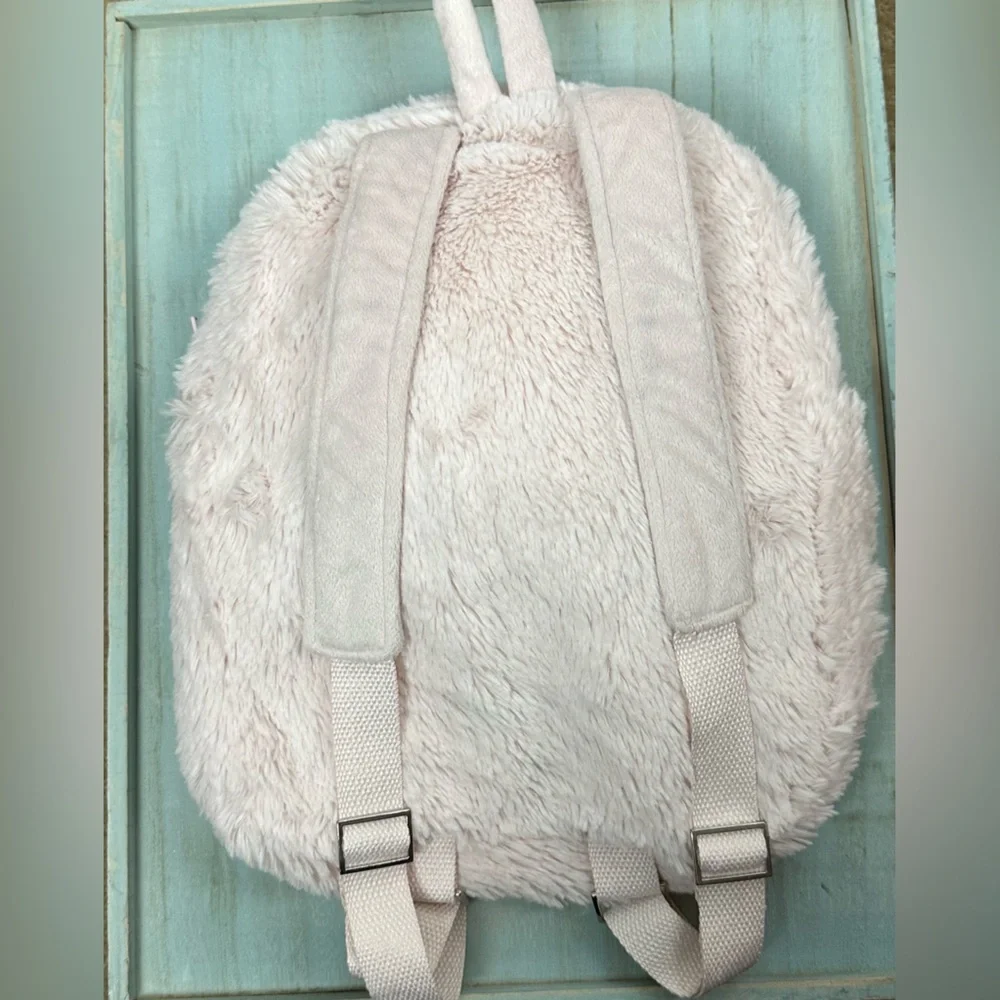 BABY & CHILD pink fuzzy kid's backpack w/ ride along for a plush buddy